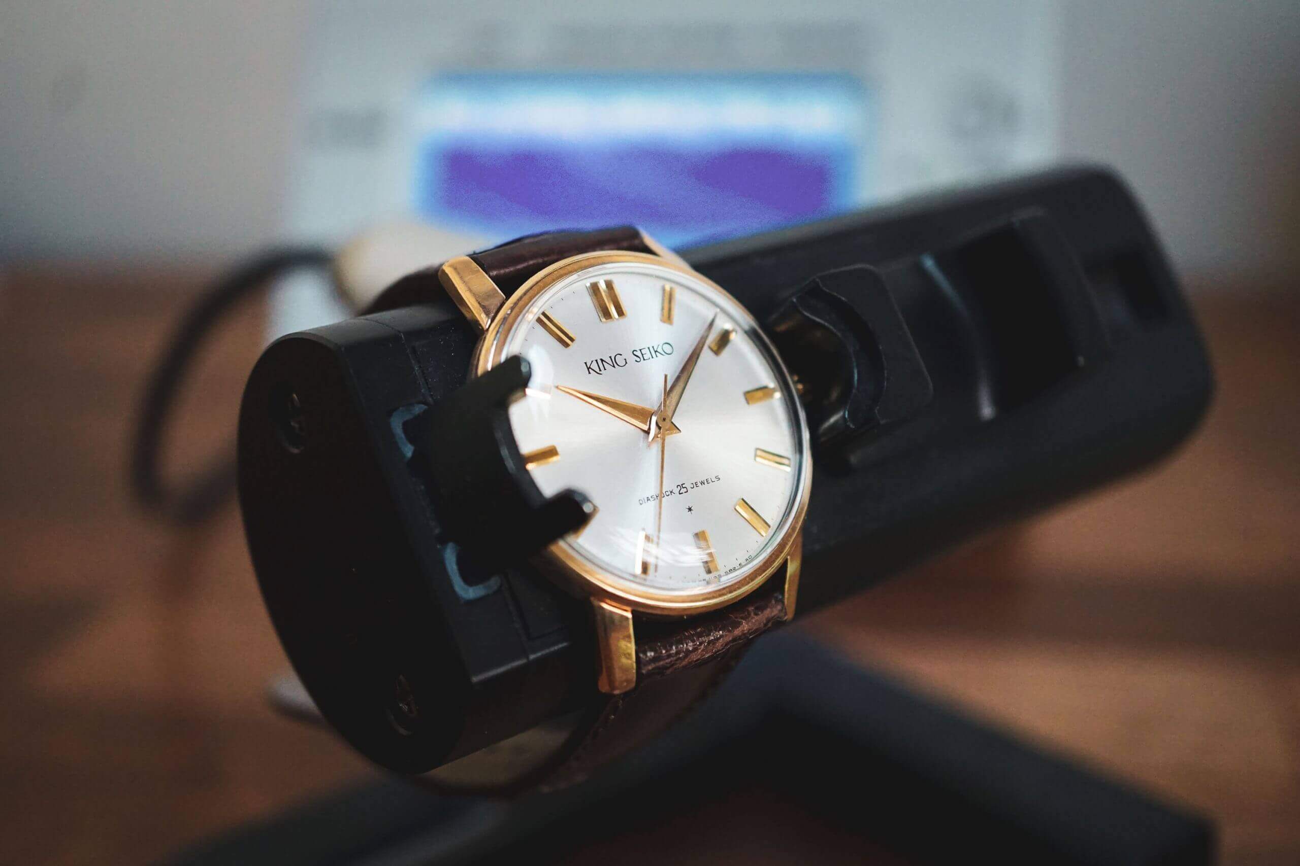 Watch timing machine showing accuracy graphs.